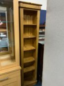 A modern slim open floor standing book case