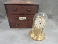 An apprentice set of drawers together with a quartz dome clock