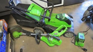 A Greenworks 40v mower together with a Greenworks blower and strimmer - contents unchecked