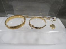 Two metal core 9ct gold bracelets together with a gold filled heart locket and a rolled gold