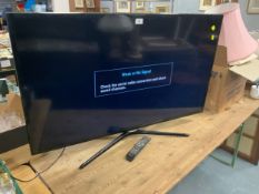 A Samsung 46” flatscreen television - remote
