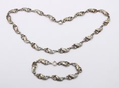 Set, Silber 800/835, Kette und Armband, floral gearbeitet, ca. L-44cm u. 18cm, zus. 26,2gr.