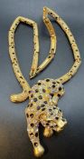 Collier, goldfarben mit Panther, dieser bestetzt mit schwarzen, klaren und changierenden Steinen (R