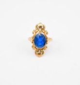 Yellow Gold Ring with Oval Blue Stone.