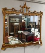 Gilt Framed Mirror With Asian Pavilion Style Crest.