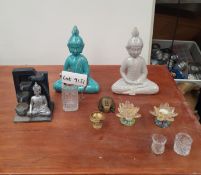 Various Buddha-themed home decor items and ornaments