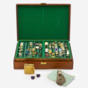 A mahogany hinged jewellery box containing a collection of base metal cuff-links etc.