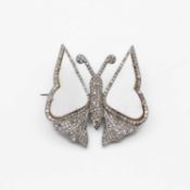 A silver white metal mother-of-pearl and diamond set butterfly brooch.