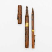 A Waterman's cased 1920's Ideal 9ct mounted 'Ripple' fountain pen and propelling pencil set.