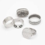 A selection of five silver gentleman's finger rings.