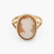A gold shell cameo set ring.