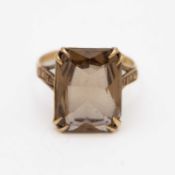 A 9k hallmarked gold smokey quartz set cocktail ring.