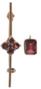 An antique garnet bar brooch and a pendant set in 9k gold.