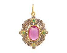 A Victorian-style silver gilt, almandine garnet, diamond, and emerald pendant.