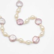 A purplish-pink and white freshwater pearl necklace.