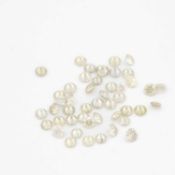 A parcel of loose round brilliant cut diamonds.