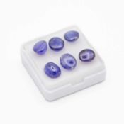A parcel of six cabochon glass-filled and heat-treated loose sapphires.