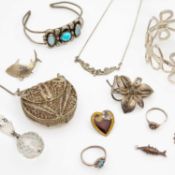 A selection of silver and white metal paste jewellery items.