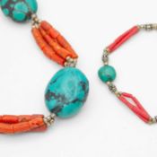 A native American Navajo silver, turquoise and red coral necklace with a similar bracelet.