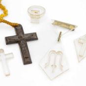 A selection of Lucite jewellery items, and a jet cross pendant.