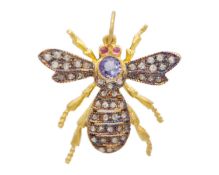 A Victorian-style tanzanite, diamond, and red spinel bee pendant.