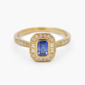 A 9k Art Deco style rectangular step-cut blue sapphire and diamond set ring.