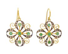 A pair of silver gilt, emerald, and diamond pendant earrings.