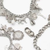 A selection of three white metal and silver charm bracelets.