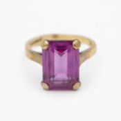 A 9k purple synthetic sapphire set dress ring.