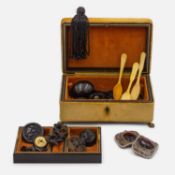 A selection of jet jewellery items in a velvet jewellery box.