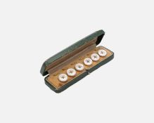 A gilt-metal mother-of-pearl dress shirt button set, within original fitted box.