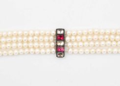 A cultured pearl four-strand opera length necklace.