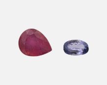 A glass filled loose ruby and a loose tanzanite.
