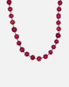 A red dyed quartz long circular bead necklace.