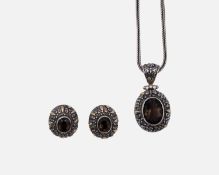 A modern Balinese 925 & 18k smokey quartz set pendant necklace & matching earrings.