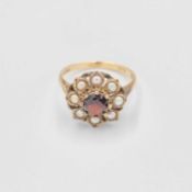 A 9k garnet and split pearl set cluster ring.