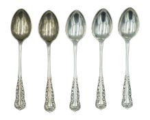 A set of five silver coffee spoons.
