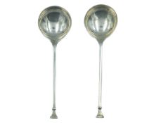 A pair of silver condiment spoons by Josiah Williams & Co.