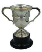 A two-handled silver trophy by James Deakin & Sons.