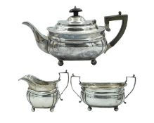 A George V silver three-piece tea set by C. S. Harris & Sons Ltd.