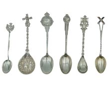 A selection of silver teaspoons.