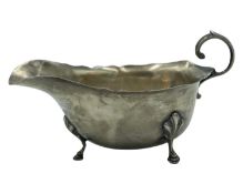 A silver sauce boat by William Greenwood & Sons.