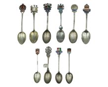 A selection of silver souvenir spoons.