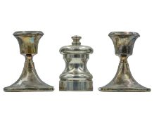 A silver capstan pepper mill.