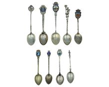 A selection of silver souvenir spoons.