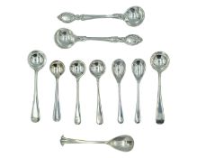 A selection of silver mustard spoons.