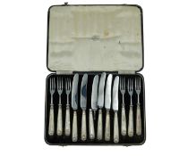 A set of silver-handled dessert cutlery by Travis, Wilson & Co Ltd.