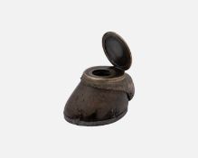 A silver-plate mounted horse hoof inkwell.