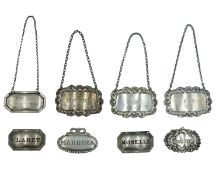 A selection of silver decanter labels.