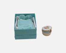 TIFFANY & CO - A French porcelain gilt-metal mounted Capricorn zodiac trinket box. Within original b